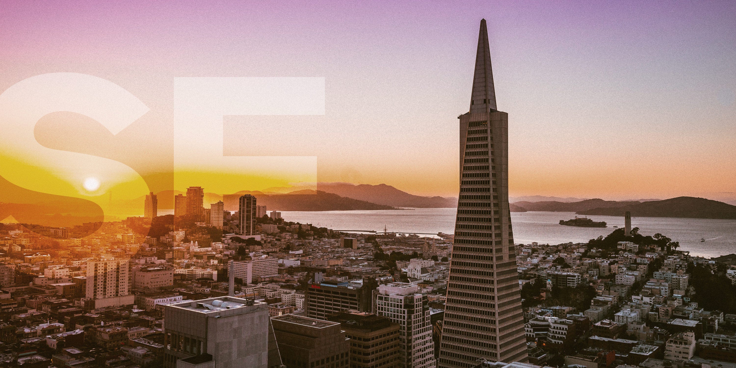 View of Trans America building and SF bay at sunset