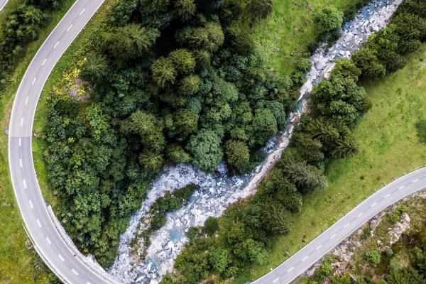 Aerial view of a car on a long, winding road