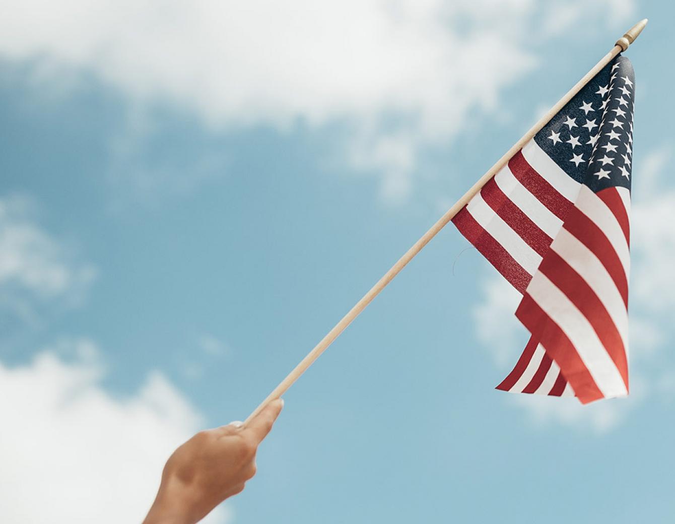 flag, blue sky, hand