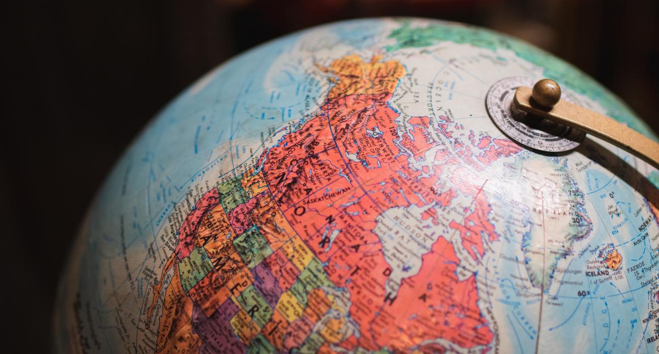 Globe of the world, with the United States and Canada at the center